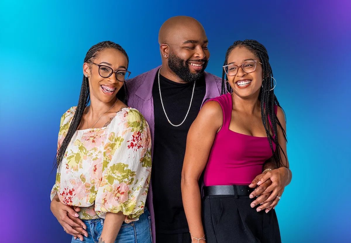Matt Johnston of 'Seeking Sister Wife' Season 6 with his arms around Anjelica and Shanay against a blue background